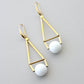 GNDE76 white and brass geometric earrings